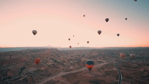 Hot Air Balloons Floating Over a Scenic Landscape