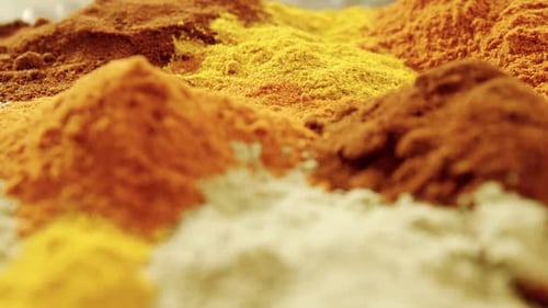 Colorful Aromatic Spices Displayed in Piles