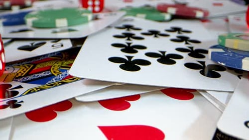 Gambling Chips and Cards on Table Macro Shot