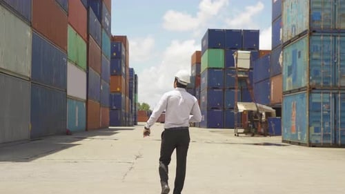 Logistic worker engineer man working in cargo container warehouse industry factory site