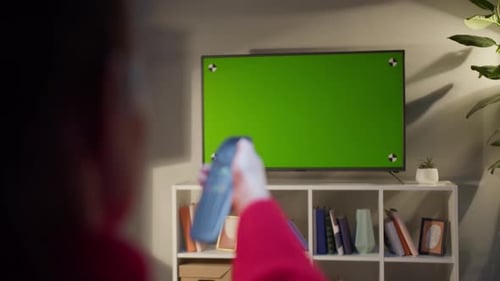 Woman Watching Television with Chroma Green Screen
