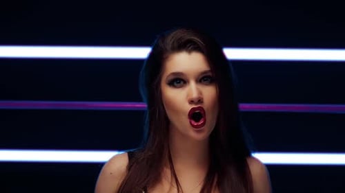 European Woman Singer Sings a Song in the Studio for a Music Video