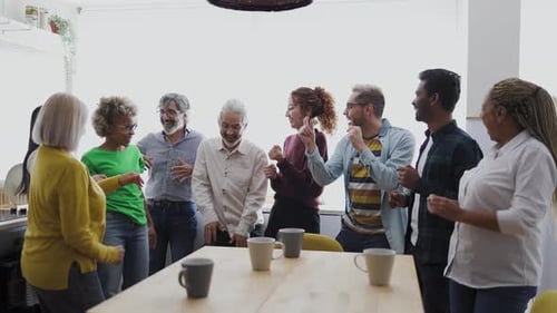 Friends Dancing Together in a Kitchen