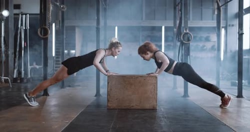 Side View Happy Attractive Young Blonde Woman Working Out with Personal Female Coach in Gym Doing