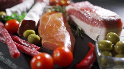 Appetizing Charcuterie Board with Assorted Meats and Vegetables