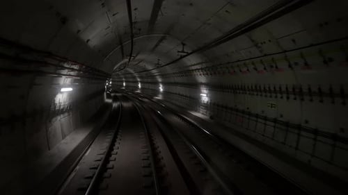 Back Cabin View of Driverless Metro Train Moving Through Underground Tunnel