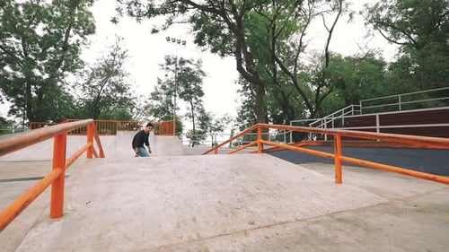 Skateboarder in Skate Park Doing Tricks Slow Motion