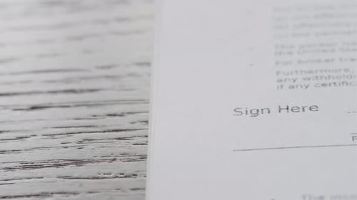 Signature on Contract By Pen in Hand