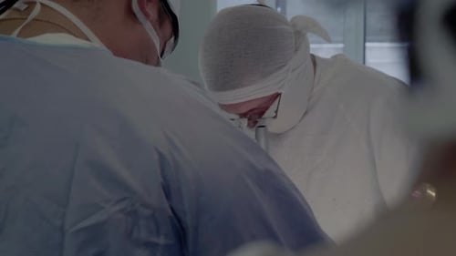 Medical Professionals Performing a Delicate Surgery in Hospital