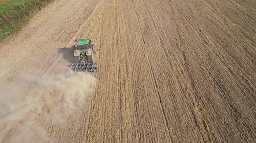 Tractor Tilling Soil in Farm Field, Aerial