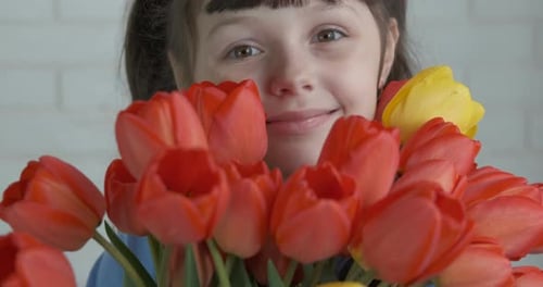 Child in spring flowers.