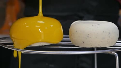 Yellow Glaze Poured Over Domed Dessert