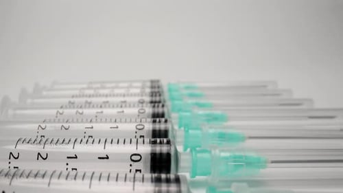 A Row of Medical Syringes