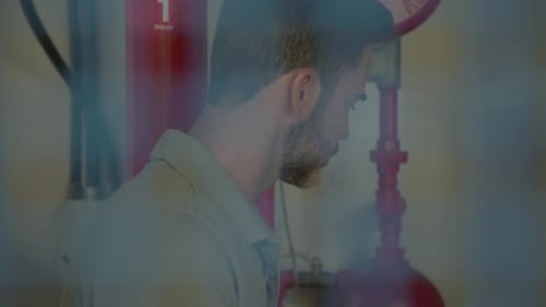 Industrial plant worker using digital tablet