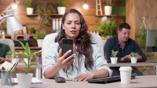 Woman on Video Call in Modern Office