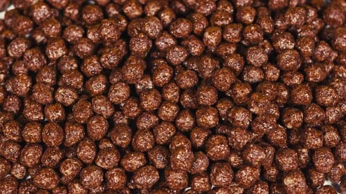 Pile of Shiny Chocolate Cereal Balls Close Up