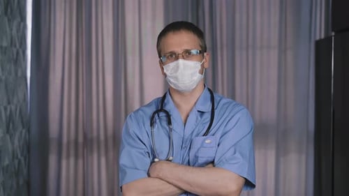 Medical Professional Wearing Blue Coat and Face Mask