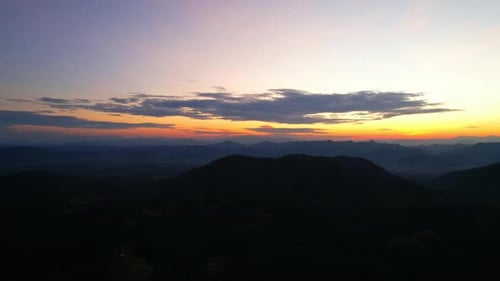 4K Aerial drone of Epic mountain with a colorful sunset