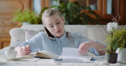 Woman Talking on Smartphone - Home Office