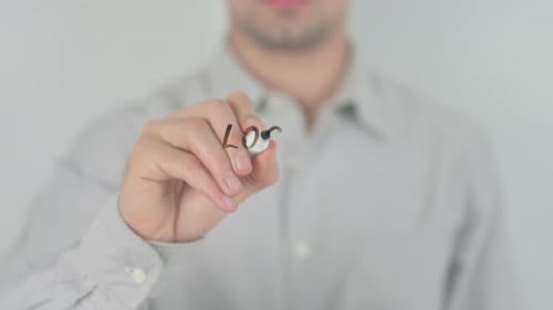 Man Writes Local Marketing on Clear Surface