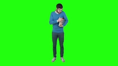 Young Adult Holds Books on Green Screen