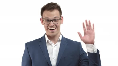 Smiling Young Adult Waving in Blue Suit