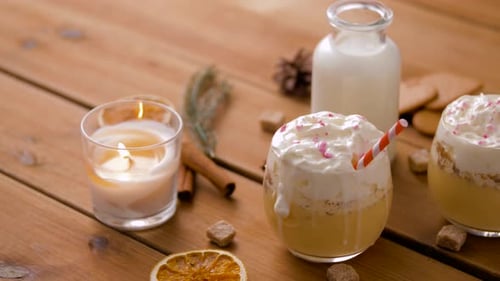 Glasses of Eggnog, Ingredients and Spices on Wood