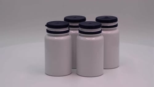 White Pill Bottles with Blue Lids