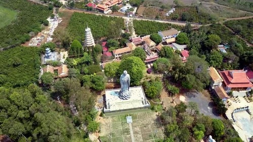 Motion To Grey Buddha Statue Situated Near Monastery