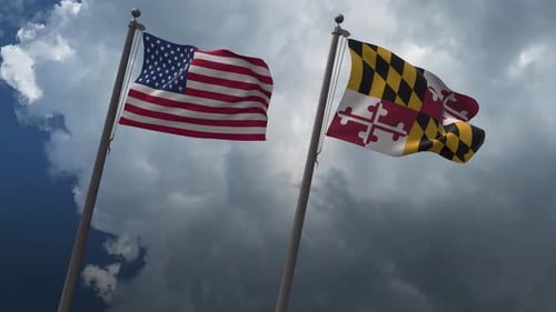 United States and Maryland Flags Waving on Cloudy Sky