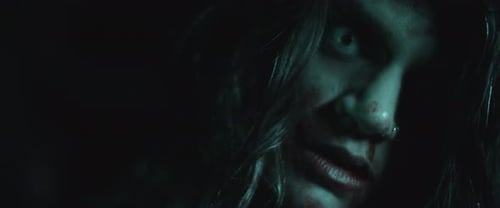 Darkness Reveals Frightening Figure Close Up