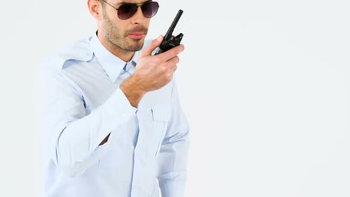 Security guard talking on walkie talkie
