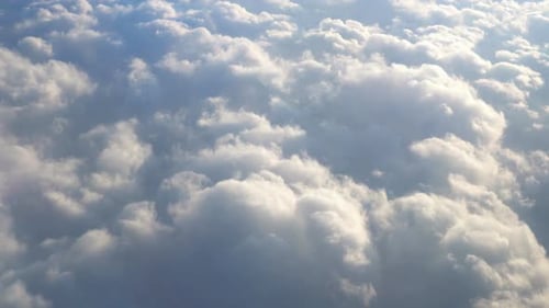 Flying Over Beautiful Clouds at Sunset. Amazing View