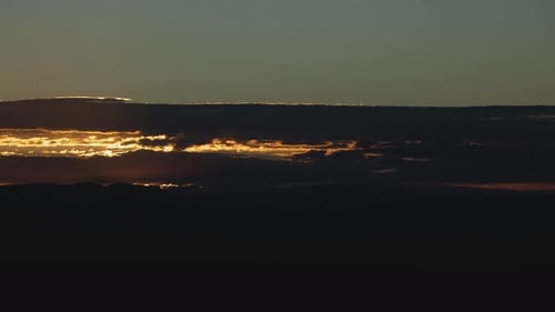 Majestic Sunrise over Mountainous Landscape and Clouds