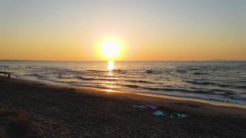 Tracking shot drone view at sunset of miditerranean sea of Sardinia, Italy