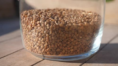 Buckwheat Groats in a Glass Jar Close Up