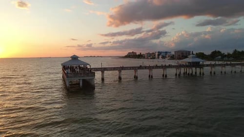 Beautiful colorful sunset at Fort Myers beach's Pier, Florida. Aerial view