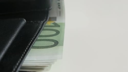 Wallet Full of Euro Banknotes on White