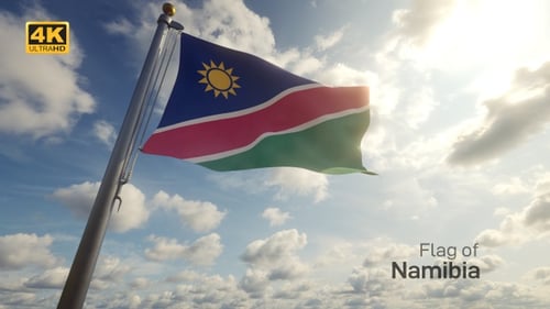 Namibia Flag Waving Against Blue Sky with Clouds