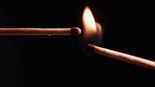 Match Ignites in Dark, Fiery Close Up