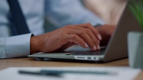 Businessman Hands Typing on Laptop Computer. Professional Using Modern Computer