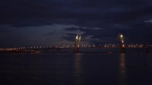 Bridge with a Road Illuminated at Night