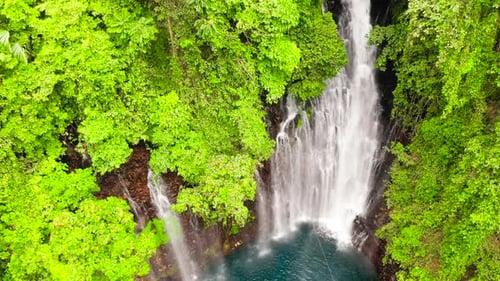 Aerial View of Breathtaking Tropical Waterfall