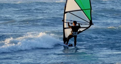 Male Surfer Windsurfing in The Beach 4k