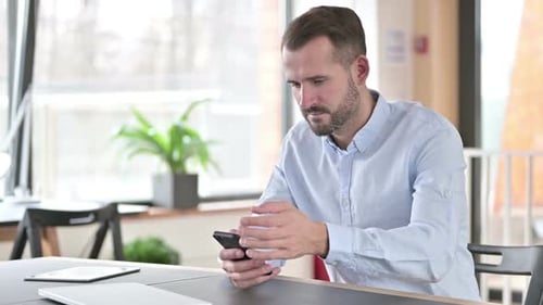 Man Receives Good News on His Mobile Phone