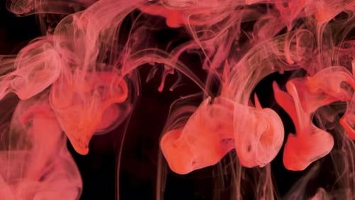 Red Ink Swirls in an Abstract Motion