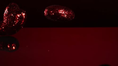 Decorations falling, bouncing in ultra slow mo