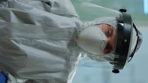 Close Up of Health Worker in Protective Suit