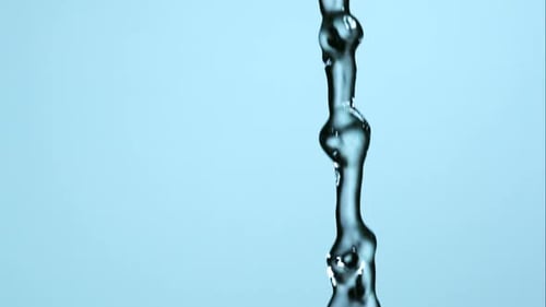 Macro Shot of Flowing Water and Bubbles