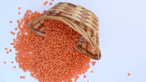 Red Lentils Spilled from Basket Overhead Shot